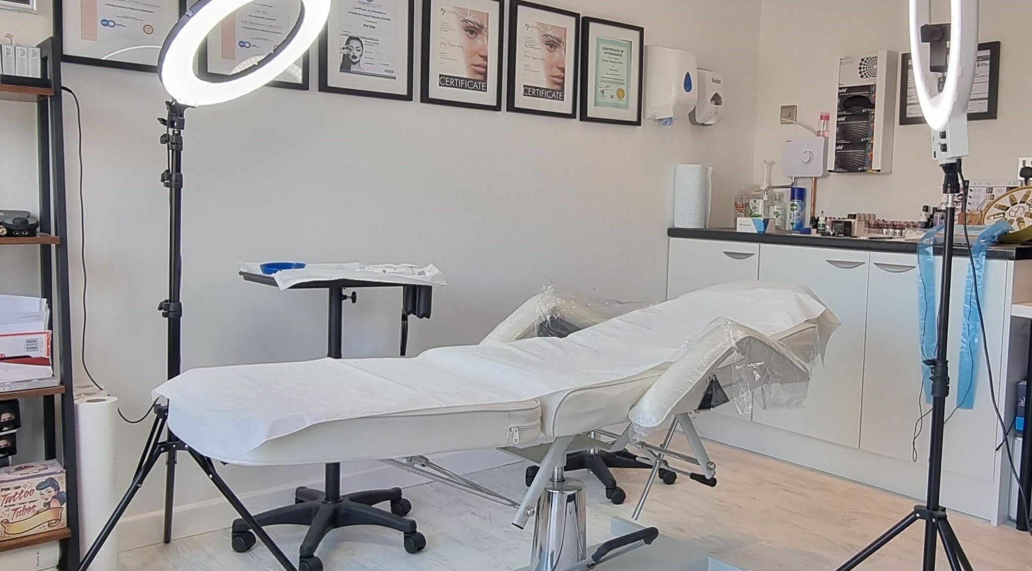 Bright treatment room at Enhance Your Glow in Penryn, England, GB with modern equipment and decor.