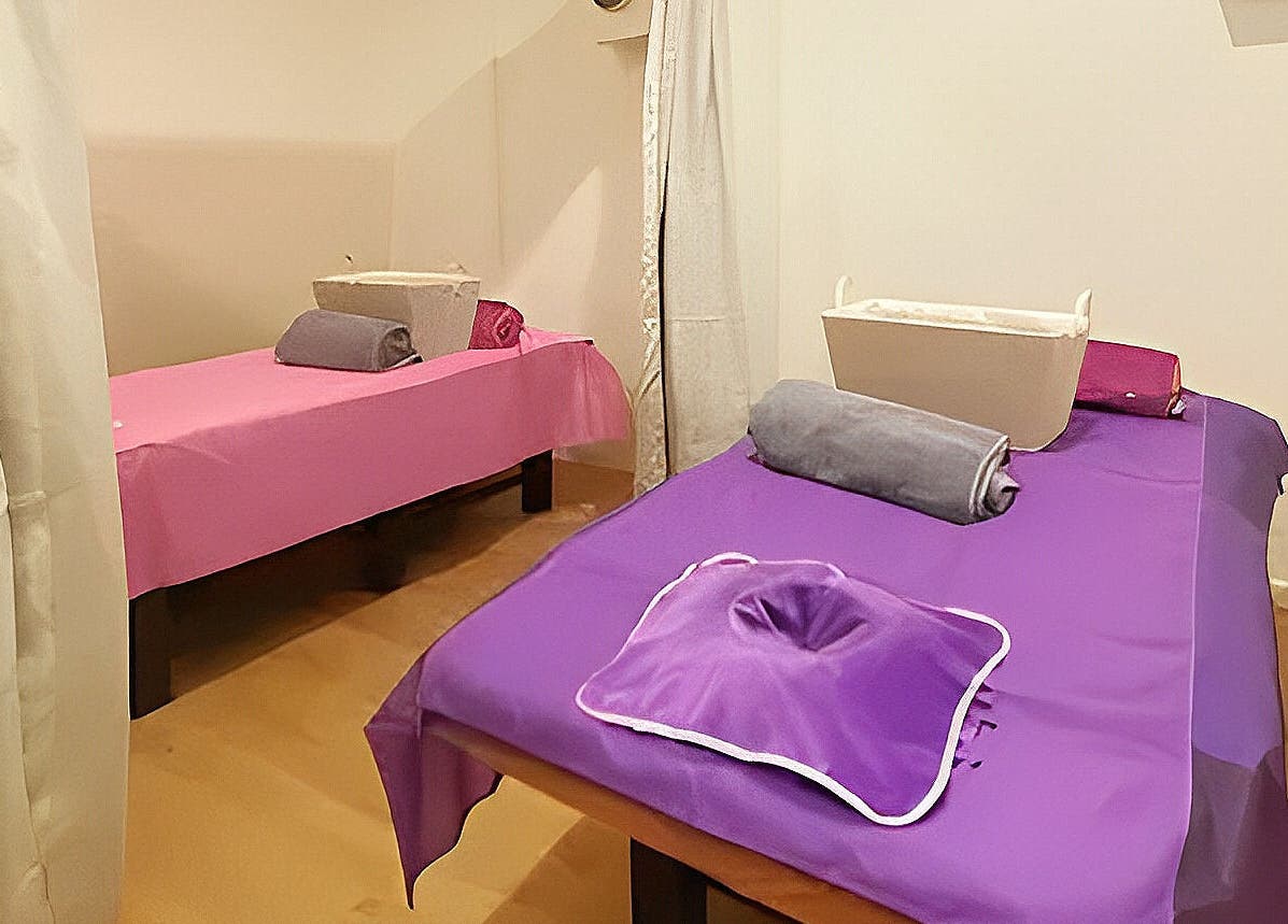 Tranquil massage room with two tables at Healing Hands Massage & Acupuncture in Brassall, Queensland, AU.