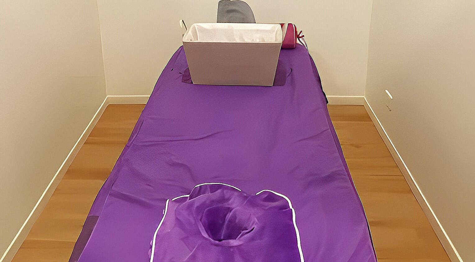 Relaxing massage table with purple cover at Healing Hands Massage & Acupuncture, Brassall, Queensland, AU.
