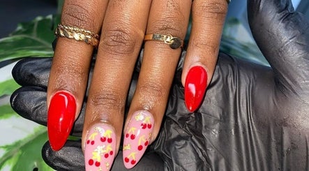 Elegant cherry nail art at Maria's Studio, Gqeberha, Eastern Cape, ZA, showcasing vibrant design.