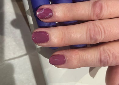 Elegant plum manicure at Ruth Elizabeth Beauty in Hinckley, England, GB, showcasing detailed nail art.