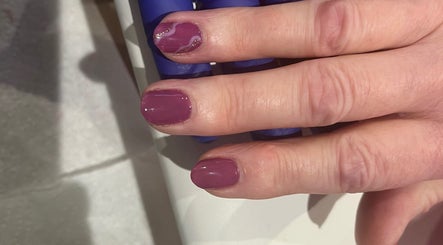 Elegant plum manicure at Ruth Elizabeth Beauty in Hinckley, England, GB, showcasing detailed nail art.