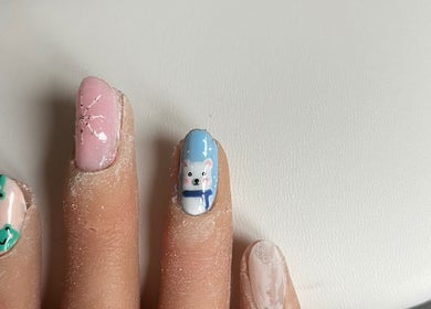 Intricate nail designs at Ruth Elizabeth Beauty in Hinckley, England, GB, featuring cute animal and snowflake motifs.