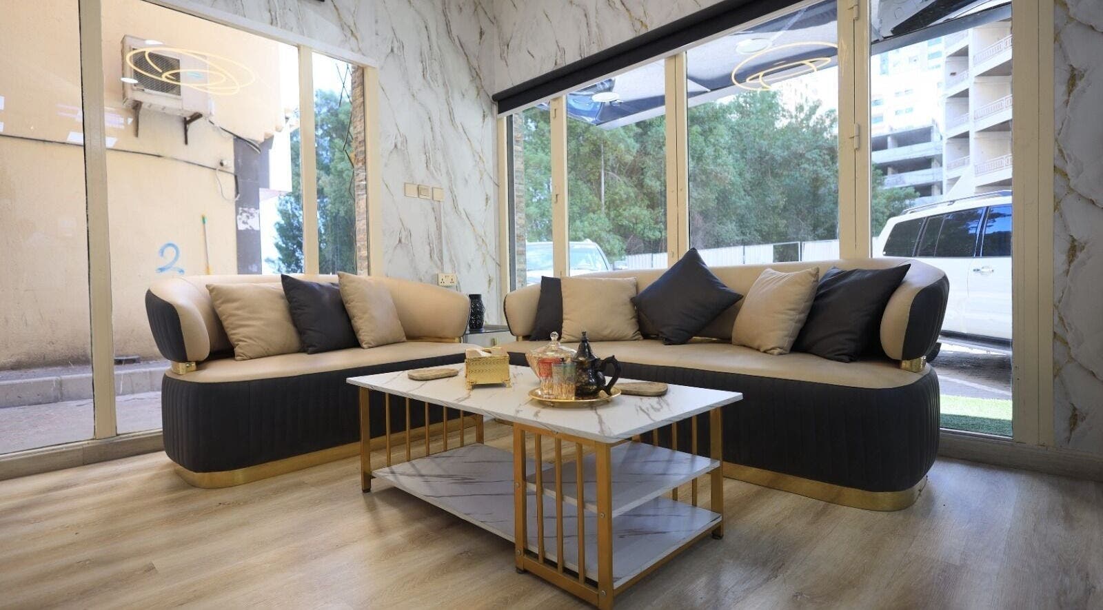 Elegant lounge at Leaders Palace Gents Care Facility, Sharjah, Sharjah, AE, featuring plush seating and decor.