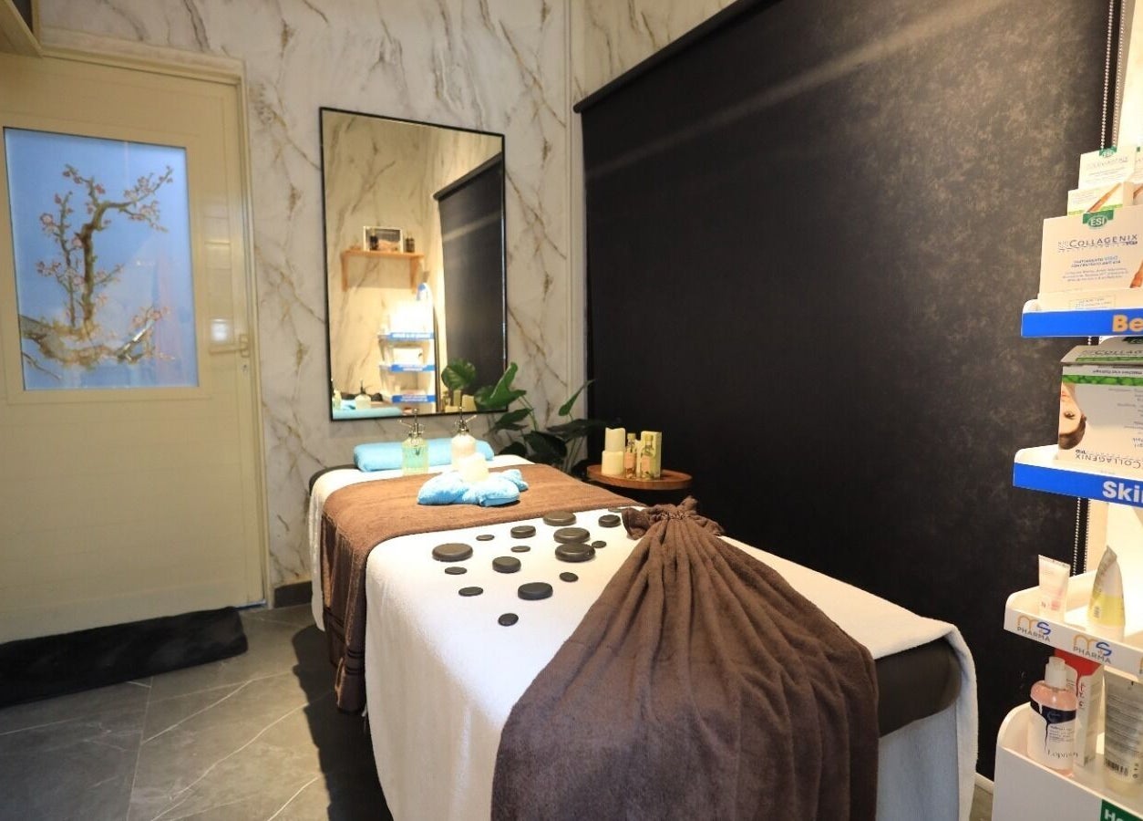 Peaceful therapy room at Leaders Palace Gents Care Facility in Sharjah, Sharjah, AE with massage table and skin care.