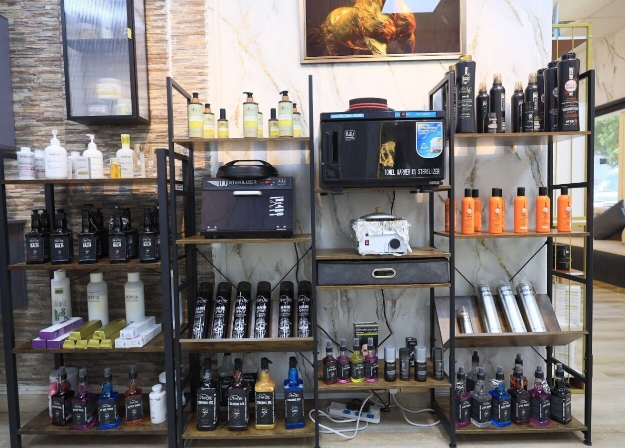 Product display shelves at Leaders Palace Gents Care Facility, Sharjah, Sharjah, AE showcasing quality grooming products.
