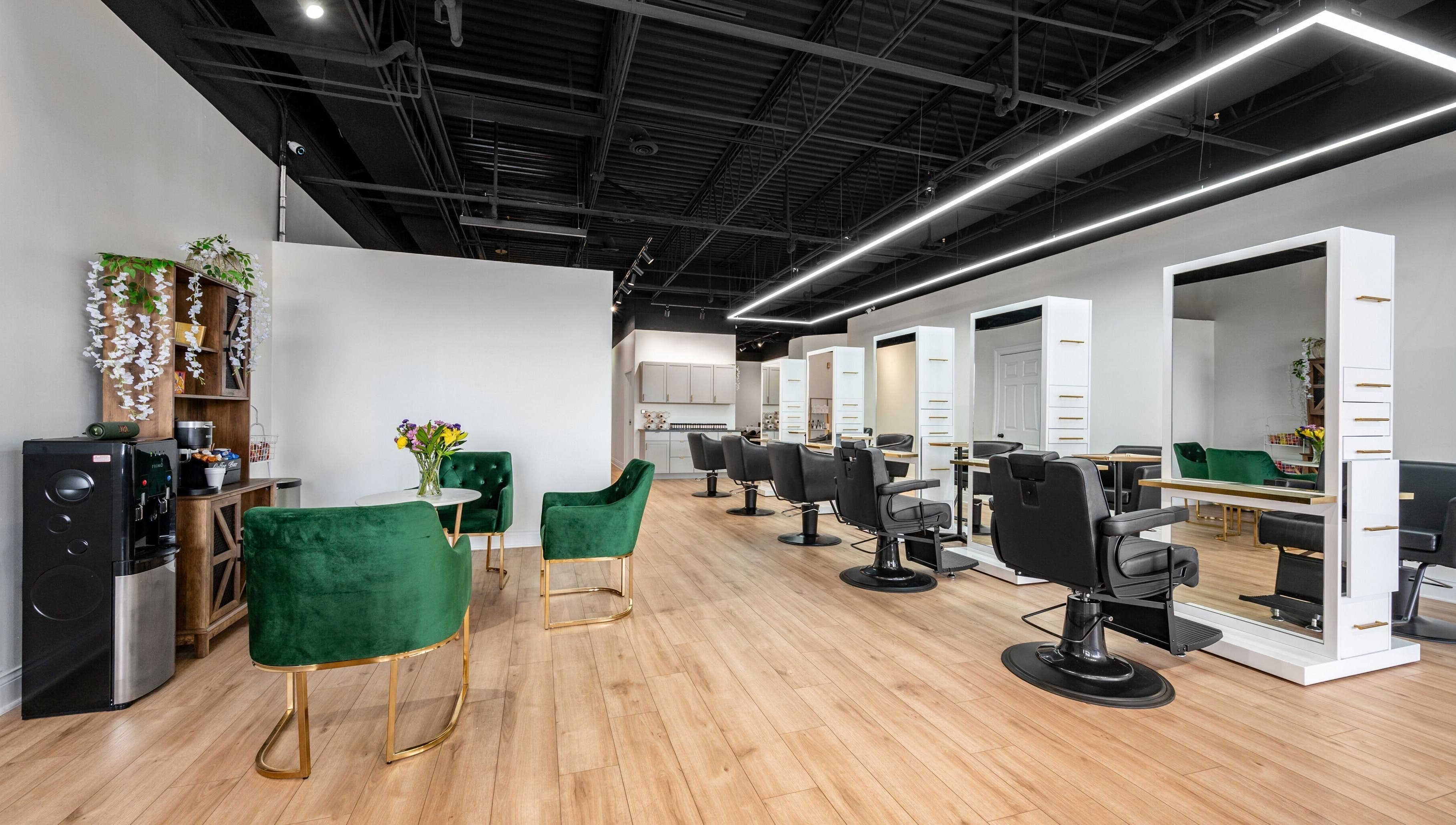 Chic interior of Artisan Theory Salon, Villa Park, Illinois, US featuring stylish chairs and modern decor.