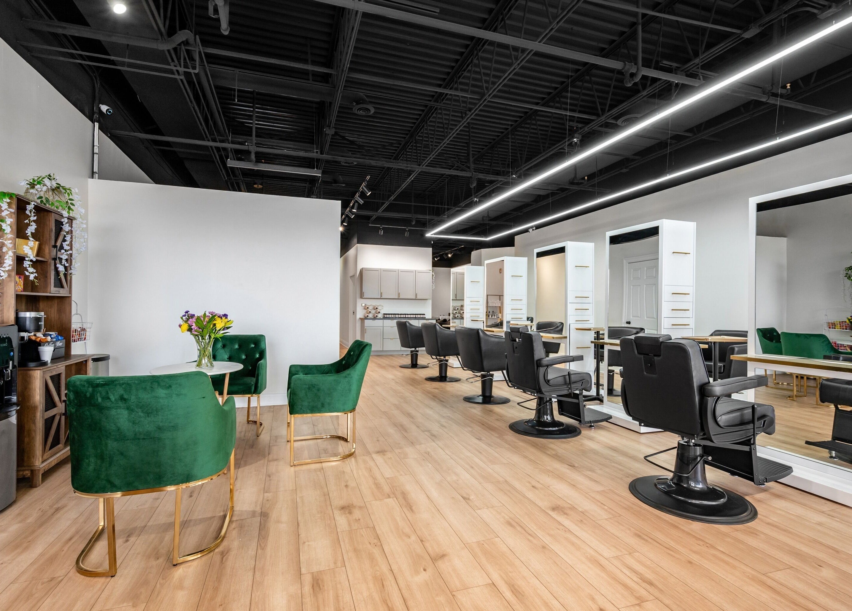 Chic interior of Artisan Theory Salon, Villa Park, Illinois, US featuring stylish chairs and modern decor.