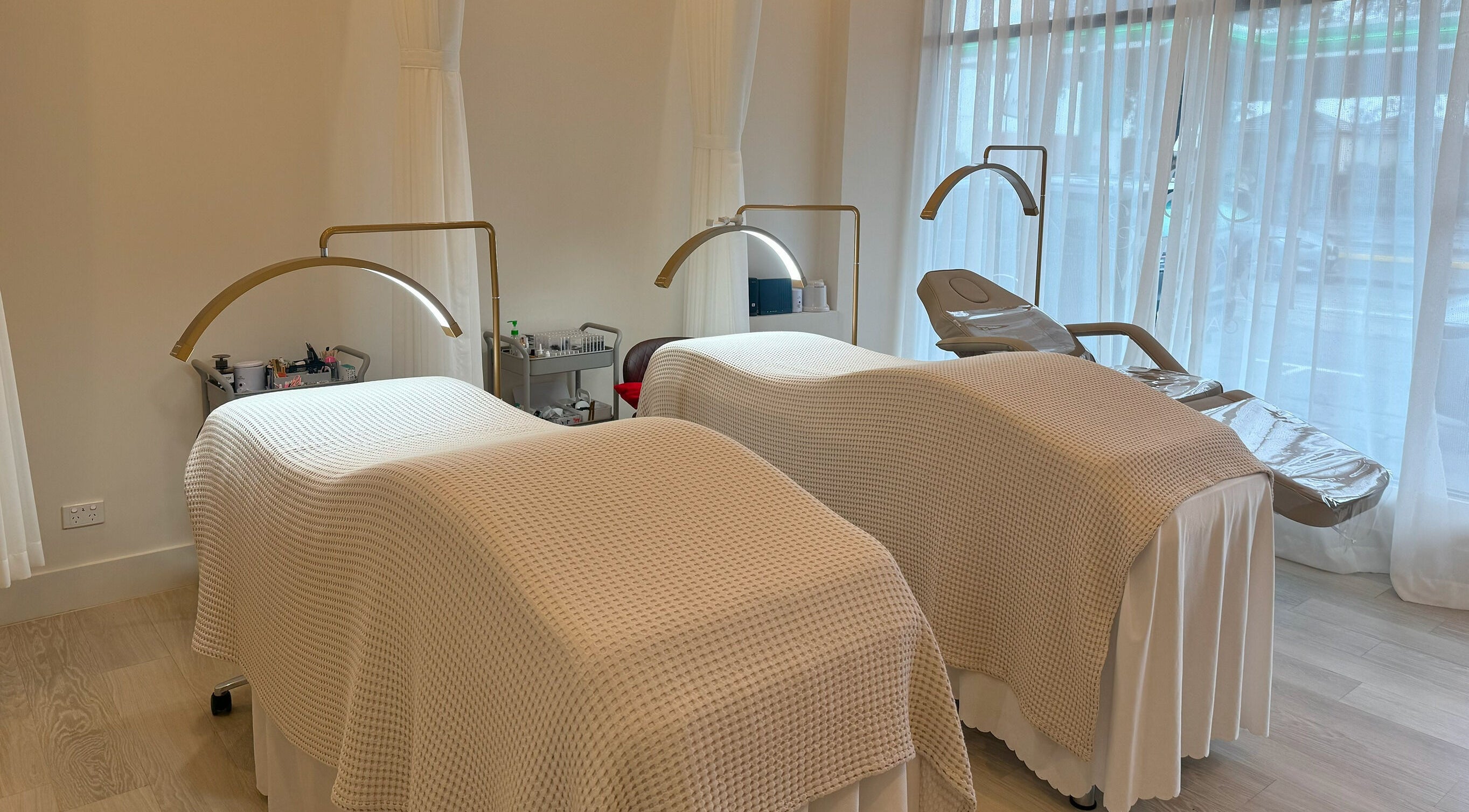 Cozy treatment beds in The Lash And Brow Gallery Malvern, Melbourne, Victoria, AU with soft lighting and serene ambiance.