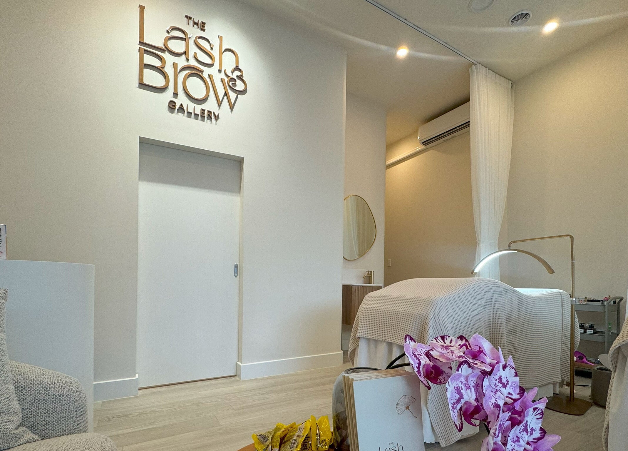 Elegant treatment room at The Lash And Brow Gallery Malvern, Melbourne, Victoria, AU with plush bed and decor.