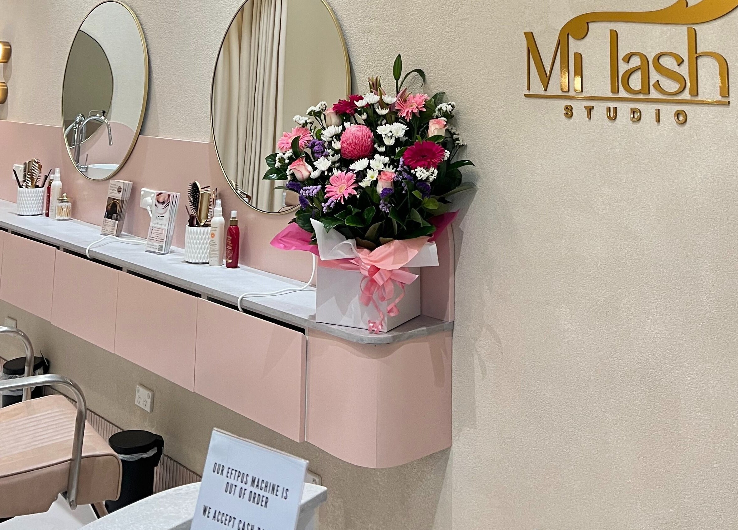 Elegant beauty station at Milash Studio Merrylands, Merrylands, New South Wales, AU with chic mirrors and floral decor.