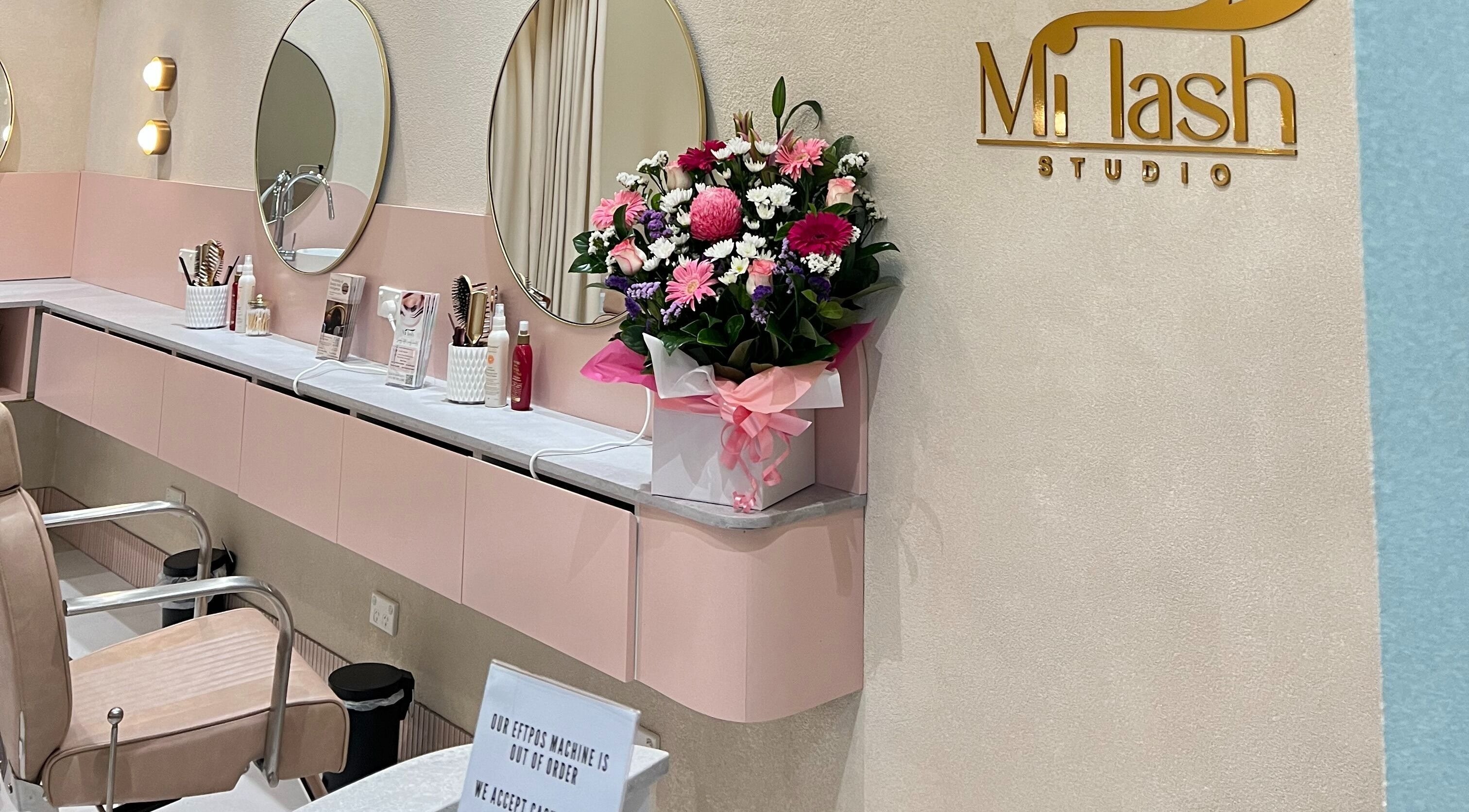 Elegant beauty station at Milash Studio Merrylands, Merrylands, New South Wales, AU with chic mirrors and floral decor.