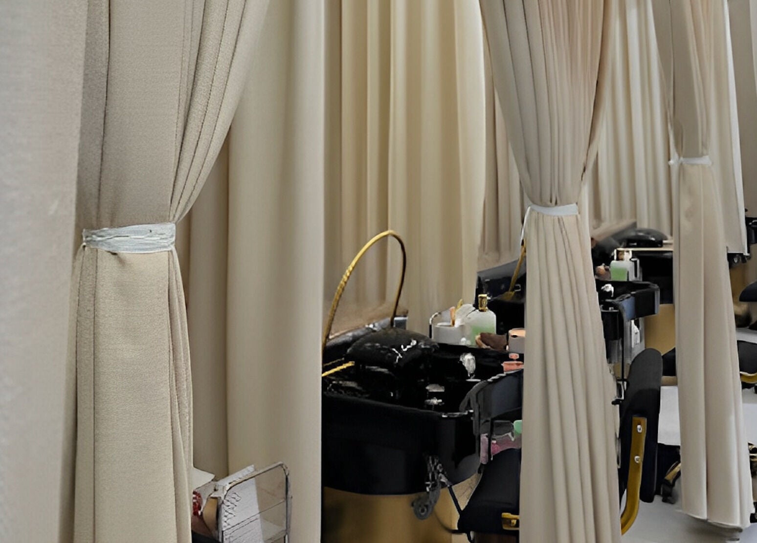 Private salon booths at Milash Studio Merrylands, New South Wales, AU with elegant curtains and styling chairs.