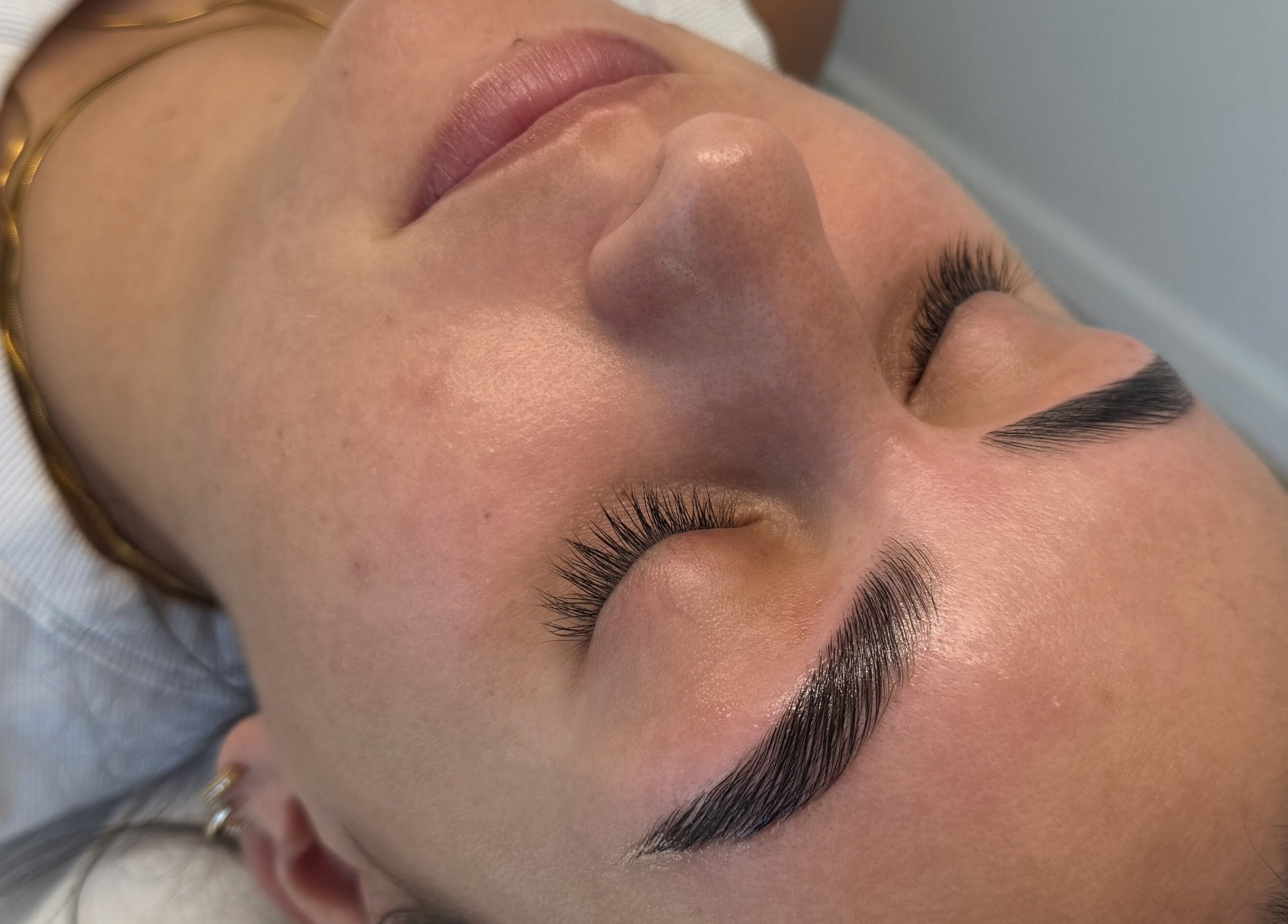 Close-up of a client's perfectly sculpted eyebrows at Defined Cosmetics, Labrador, Queensland, AU.