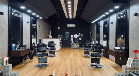 Modern interior of 1998 Barbeiro in Kajang, Selangor, MY with sleek black chairs and stylish decor.