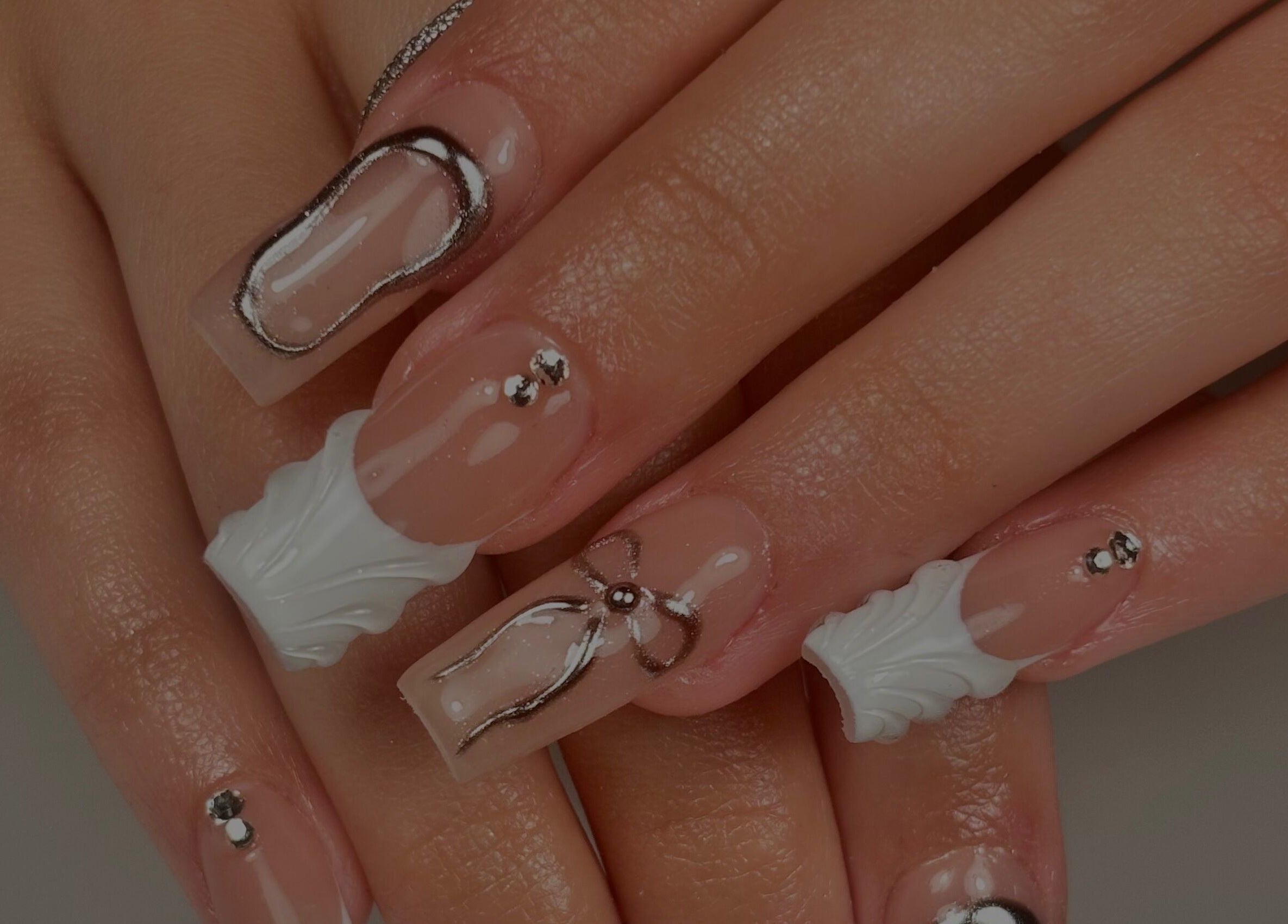 Intricate nail art on manicured hands at Nanesdivinedit, Flagstone, Queensland, AU.