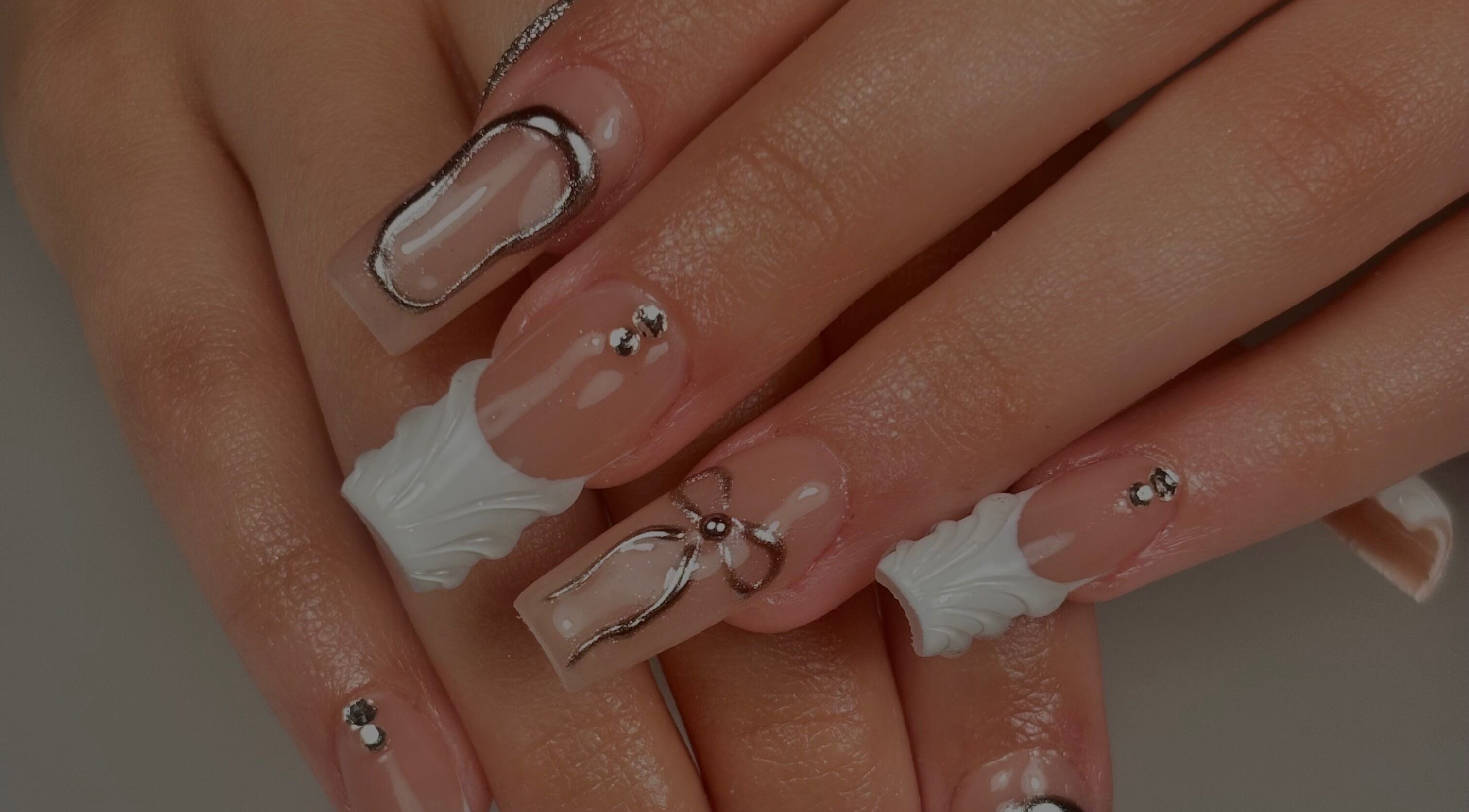 Intricate nail art on manicured hands at Nanesdivinedit, Flagstone, Queensland, AU.