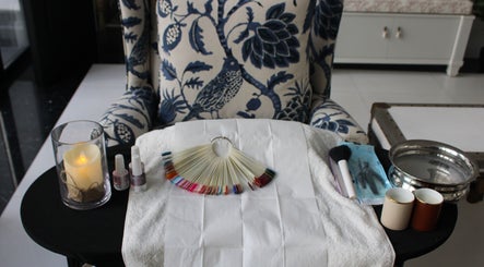 Manicure setup with polish and tools at I.T Nails - Home Service in Riyadh, Riyadh Province, SA.