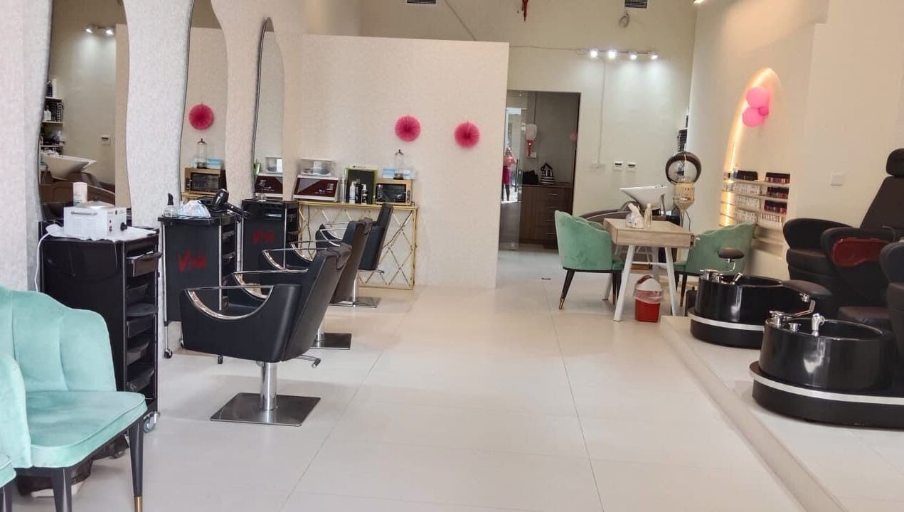 Chic interior of Streaks Ladies Salon - JLT in Dubai, Dubai, AE featuring comfortable seating and modern decor.