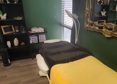 Relaxing therapy room at Everyday Elegance Spa, West Jordan, Utah, US with soothing decor and plush treatment bed.