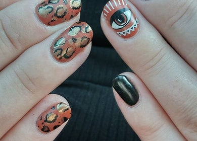 Intricate nail art at Everyday Elegance Spa, West Jordan, Utah, US, with leopard spots and abstract designs.