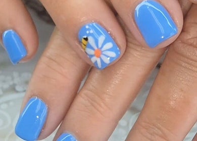Blue floral nail art at Everyday Elegance Spa, West Jordan, Utah, US, showcasing intricate hand-painted design.