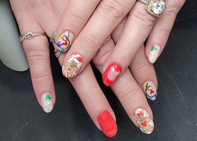Holiday-themed nail art design at Everyday Elegance Spa in West Jordan, Utah, US with festive decorations.