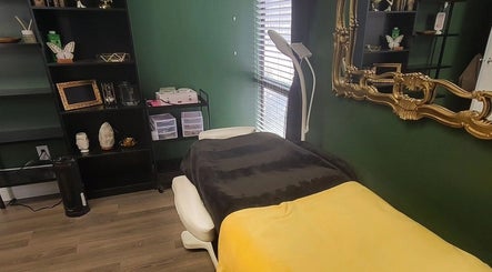 Cozy treatment room at Everyday Elegance Spa in West Jordan, Utah, US with massage table and elegant decor.