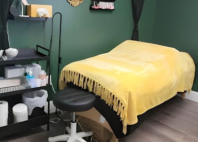 Treatment room with yellow blanket at Everyday Elegance Spa, West Jordan, Utah, US.