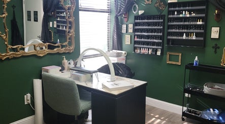 Chic nail care setup at Everyday Elegance Spa in West Jordan, Utah, US with green walls and ornate mirror.