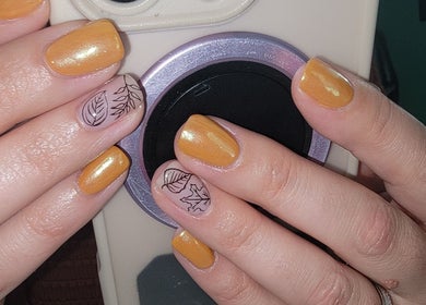 Elegant nail art with leaf designs at Everyday Elegance Spa, West Jordan, Utah, US.