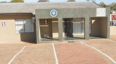 Entrance of Serenity Wellness & Beauty Spa in Gqeberha, Eastern Cape, ZA, showcasing a welcoming exterior.