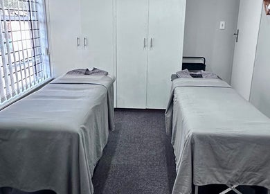 Double treatment room at Serenity Wellness & Beauty Spa, Gqeberha, Eastern Cape, ZA, featuring two massage beds.