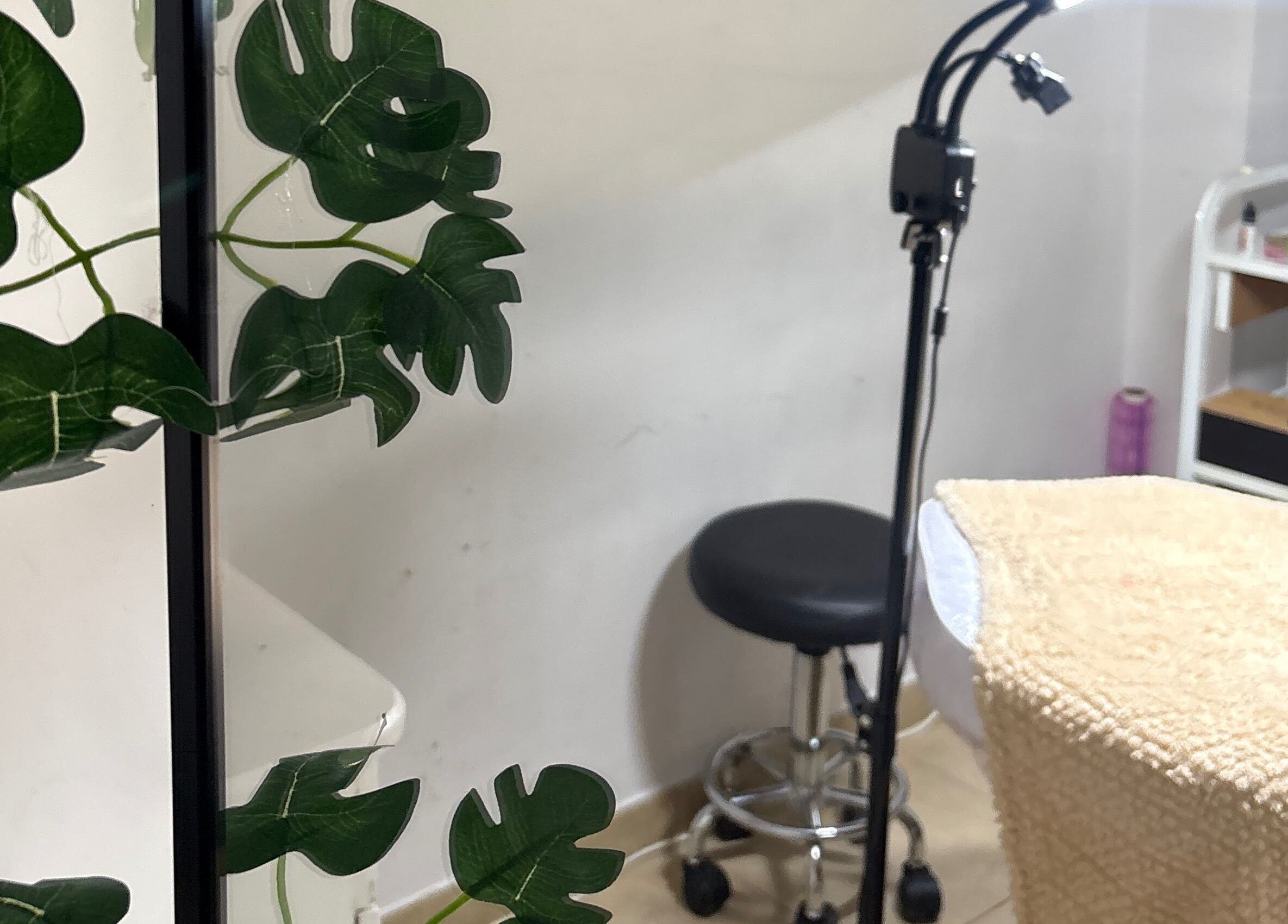 Espaço de tratamento acolhedor no Studio Maria Nascimento, Anderlecht, Bruxelles, BE, com decoração suave.