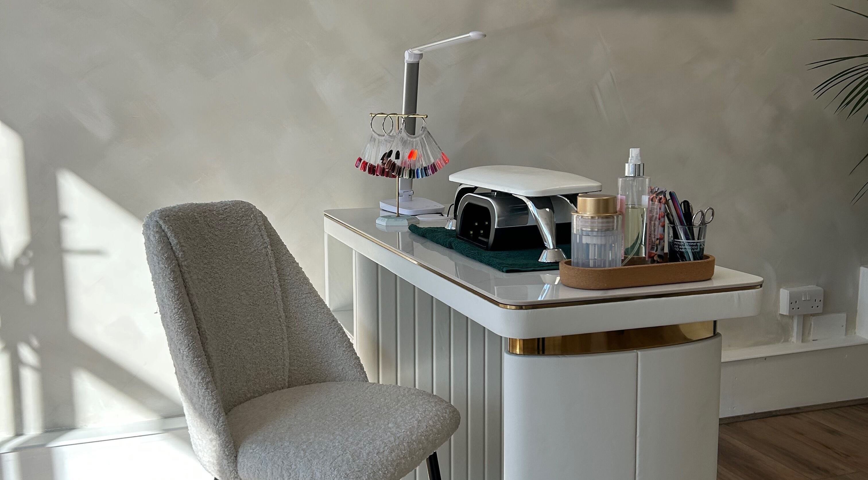 Elegant nail station at Profiles Skin & Beauty, Bexhill, England, GB with tools and nail polish samples.