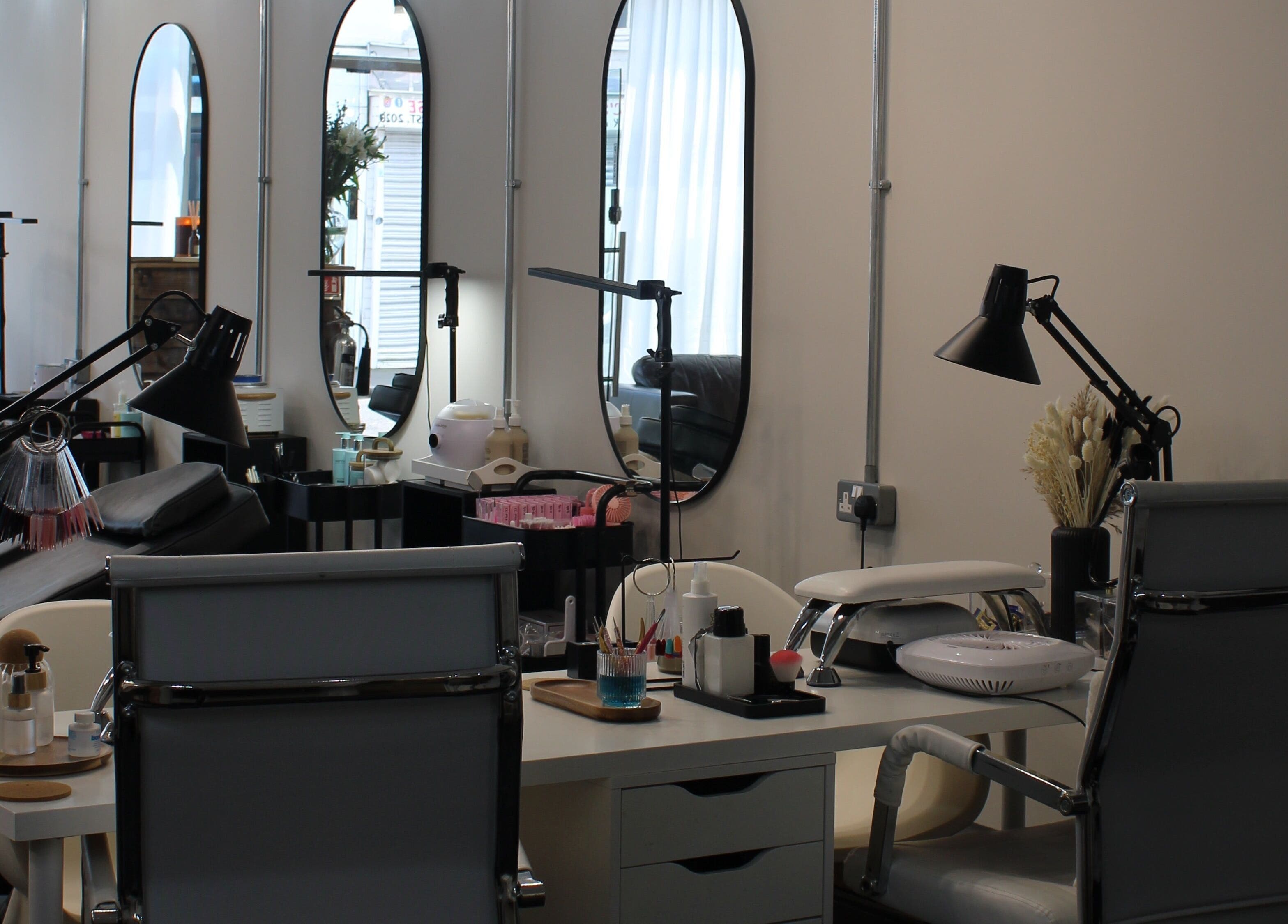 Modern nail station at Nailzbycode, Kidderminster, England, GB, with mirrors and stylish decor.