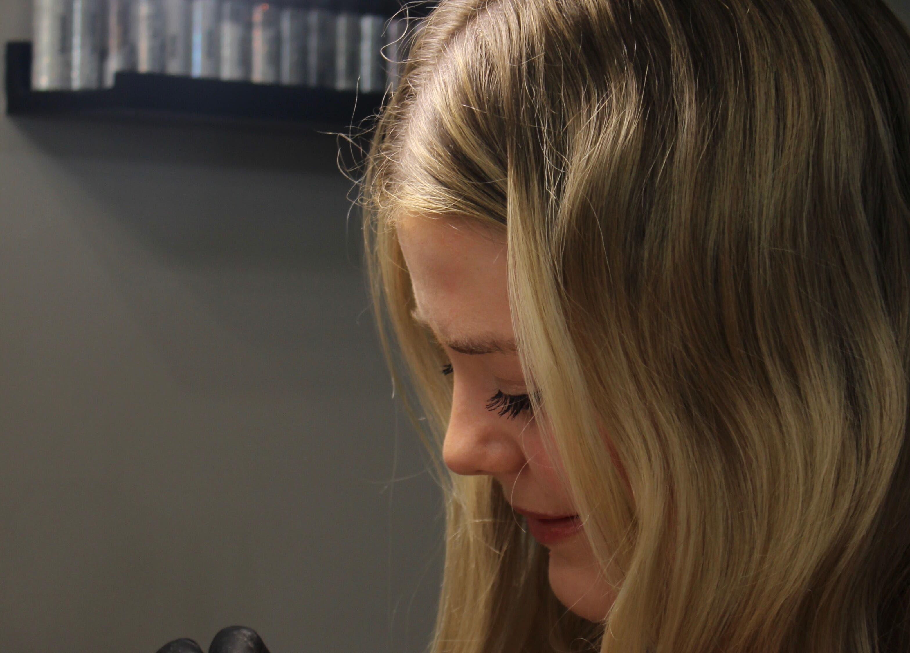 Detail of a skilled nail technician at Nailzbycode, Kidderminster, England, GB, focusing on her work.