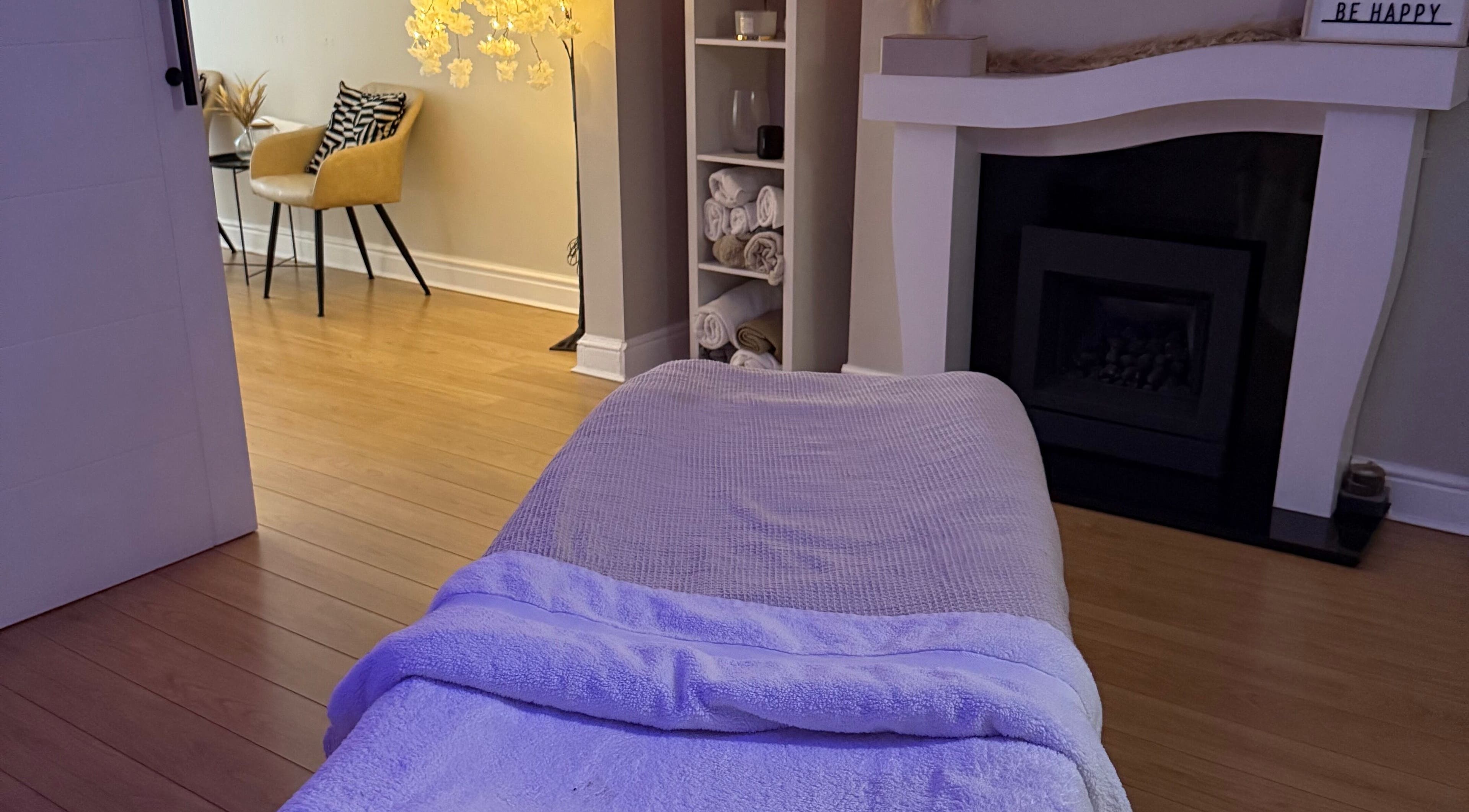 Calming massage room at Touch Of Shannon, Workington, England, GB, with soft lighting and cozy decor.
