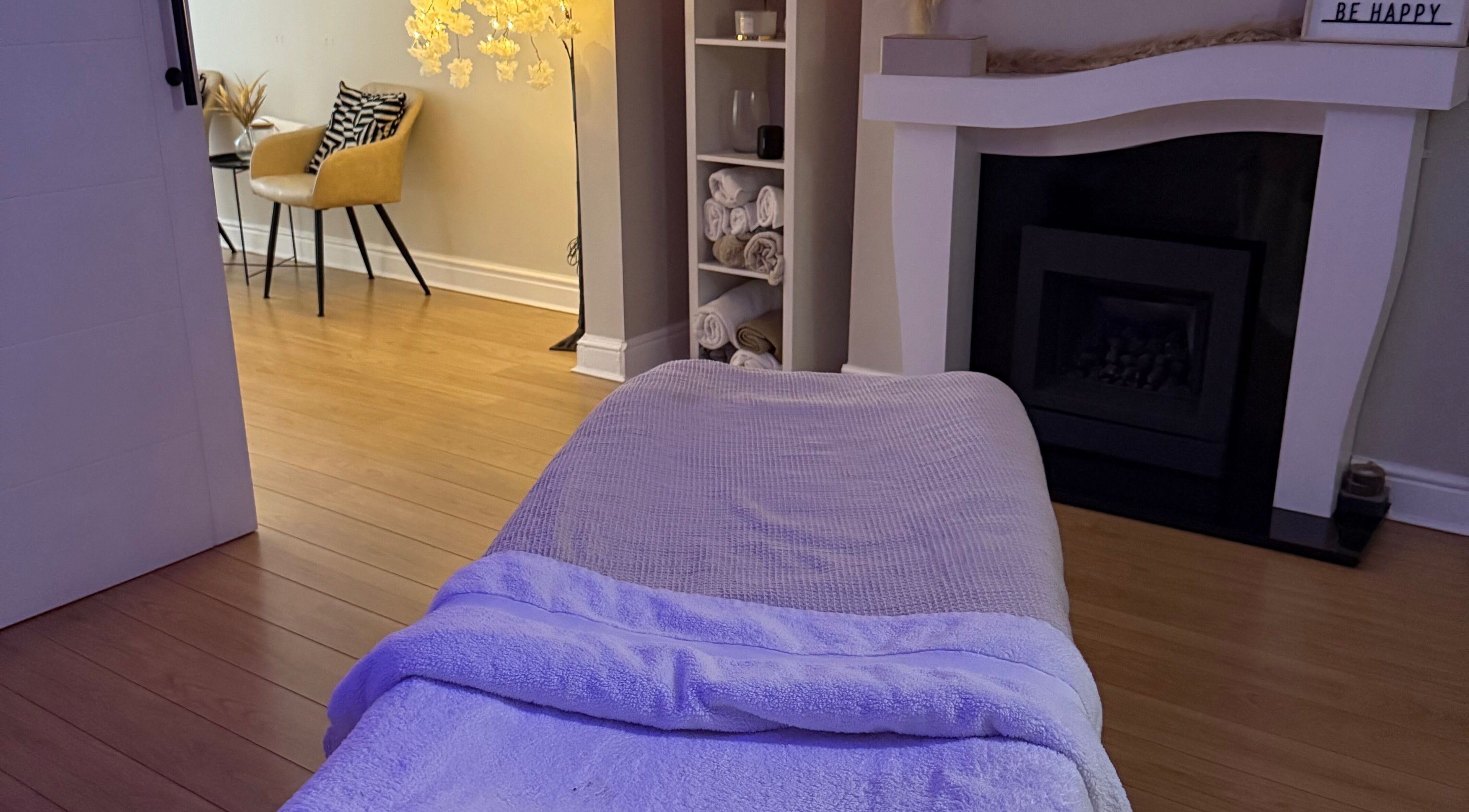 Calming massage room at Touch Of Shannon, Workington, England, GB, with soft lighting and cozy decor.