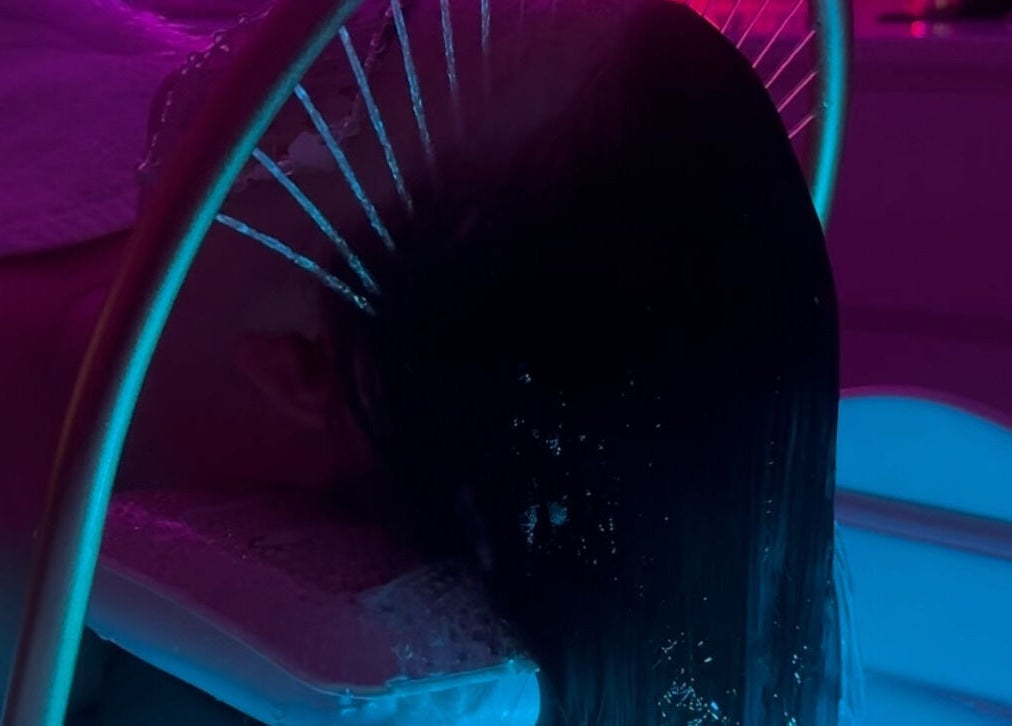 Relaxing neon-lit hair wash at Touch Of Shannon, Workington, England, GB, offering a unique wellness experience.