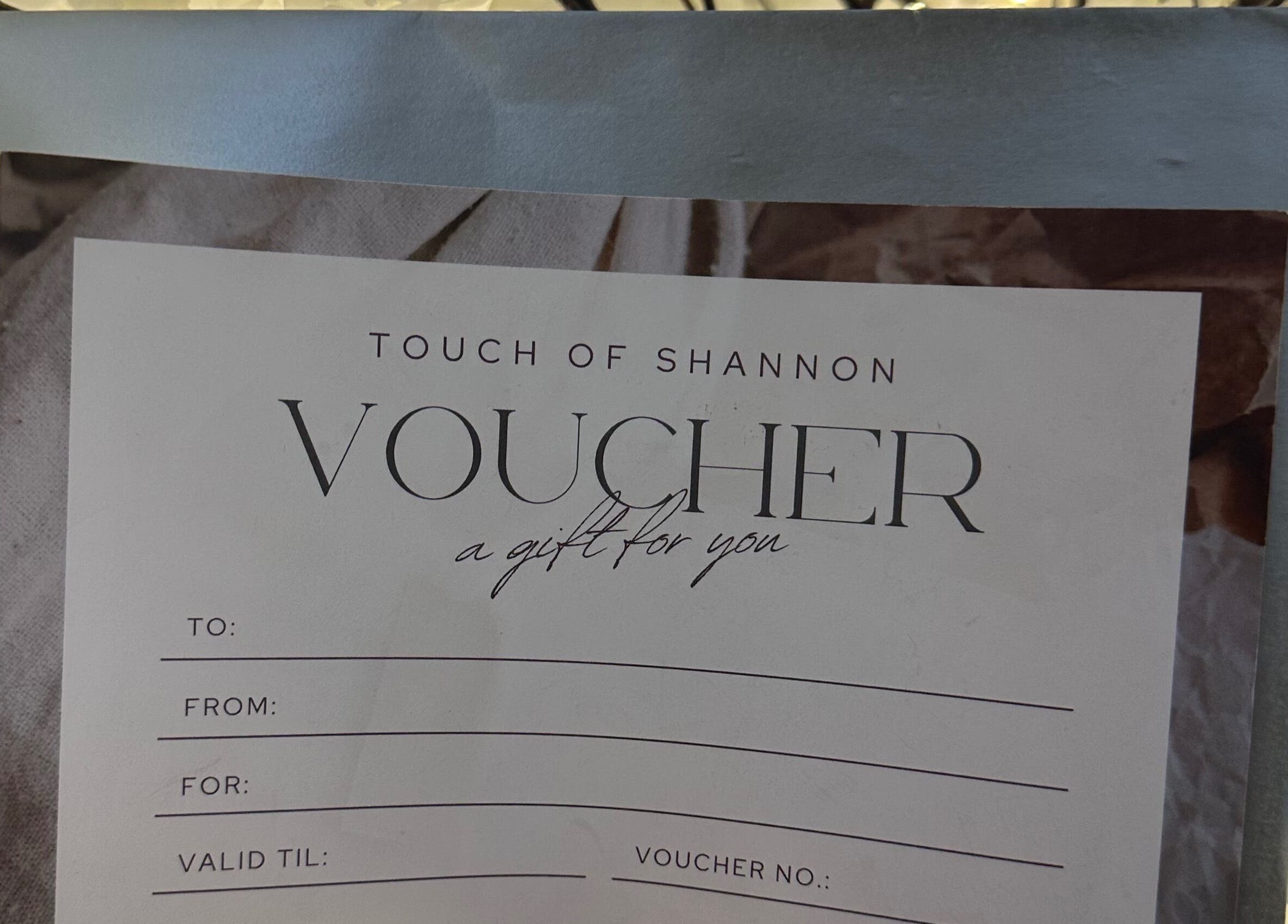 Touch Of Shannon gift voucher on display in Workington, England, GB, offering a personalized wellness experience.