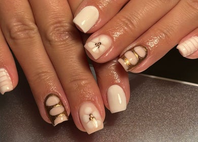Elegant nail art with white polish at Biabs By Abs, Llansamlet, Wales, GB showcasing intricate designs.
