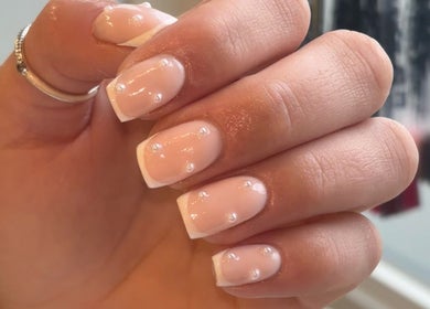 Beautiful pearl-accented nails at Biabs By Abs, Llansamlet, Wales, GB. Elegant and stylish manicure design.