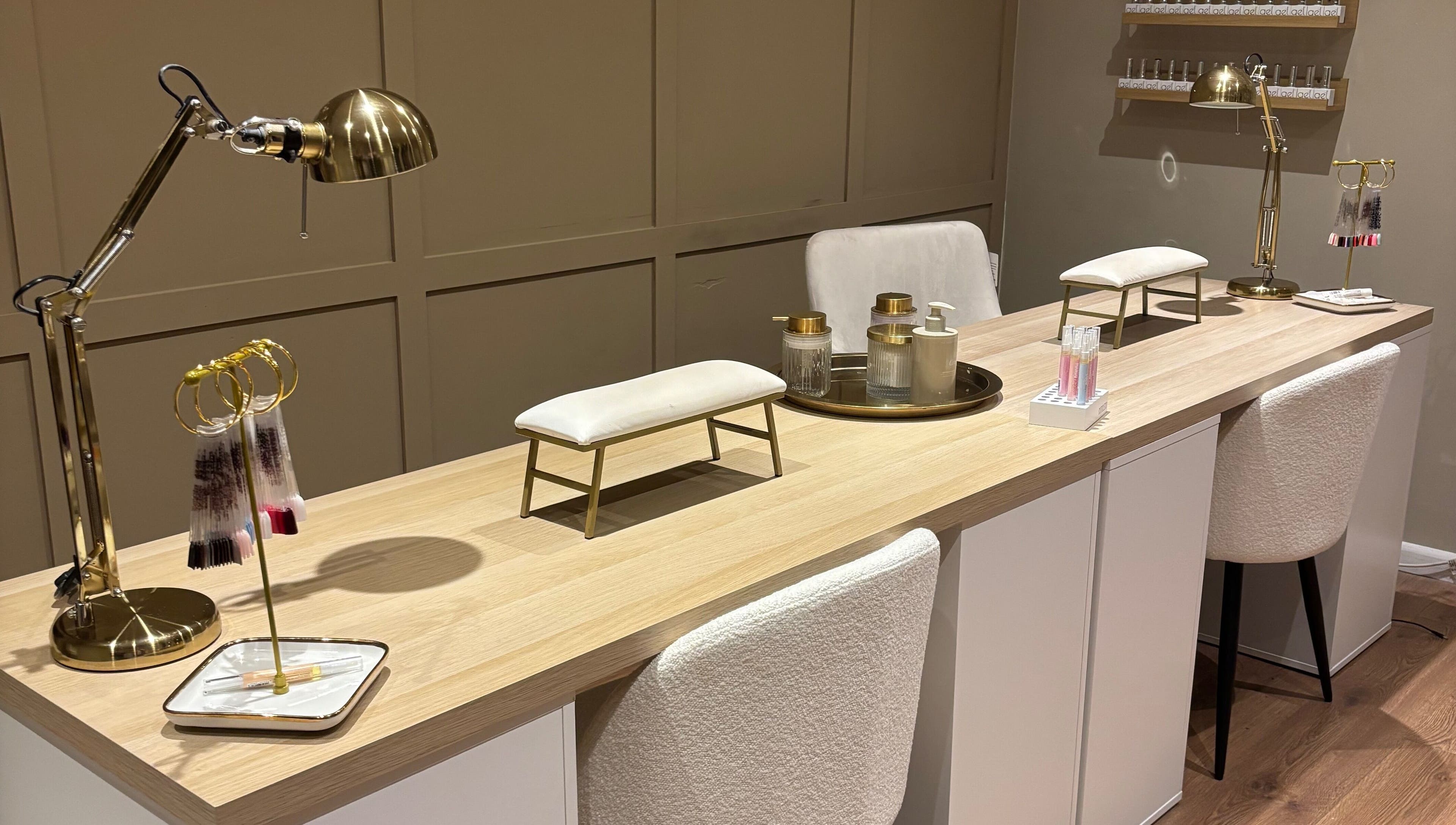 Chic nail station at Biabs By Abs, Llansamlet, Wales, GB with plush seating and gold accents.