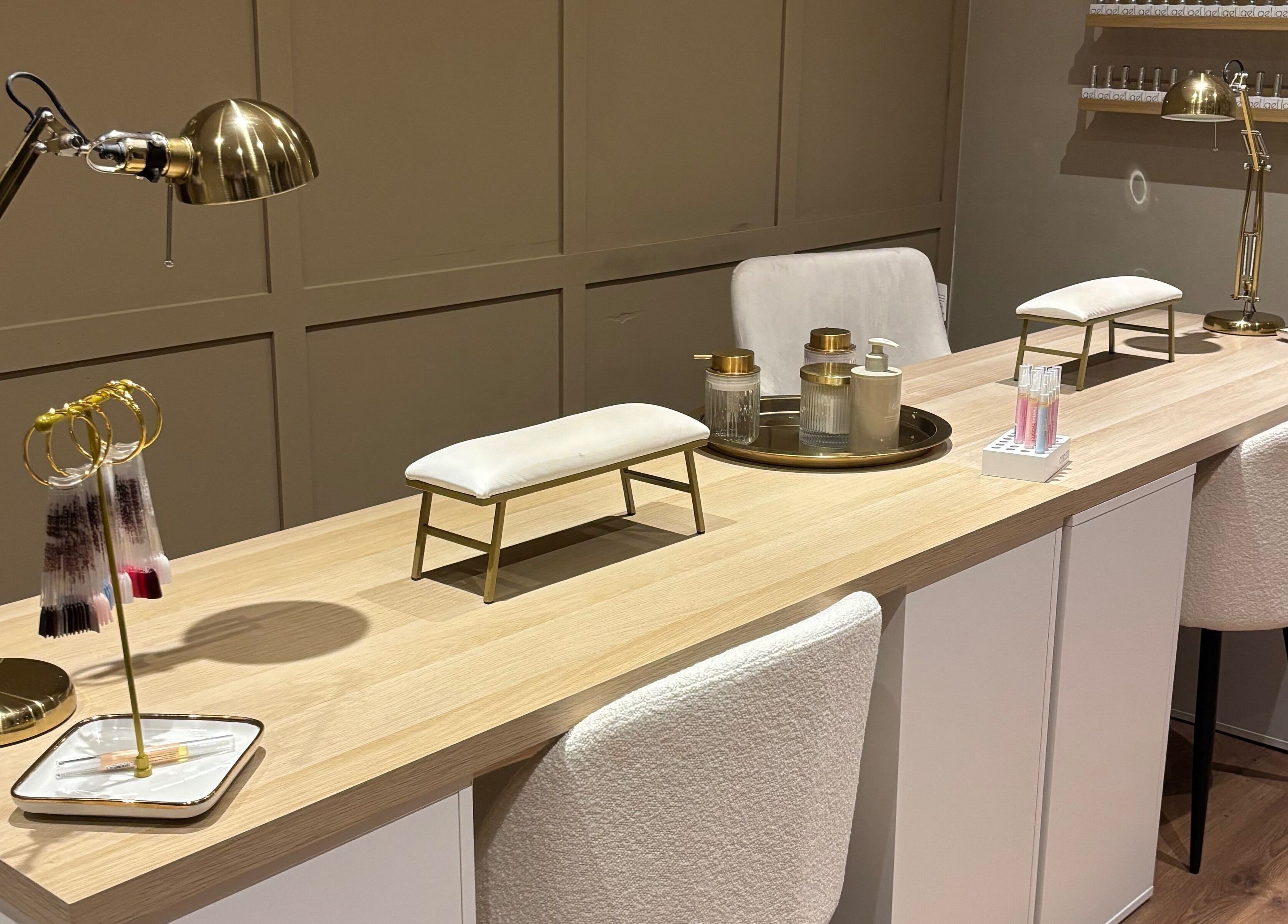 Chic nail station at Biabs By Abs, Llansamlet, Wales, GB with plush seating and gold accents.