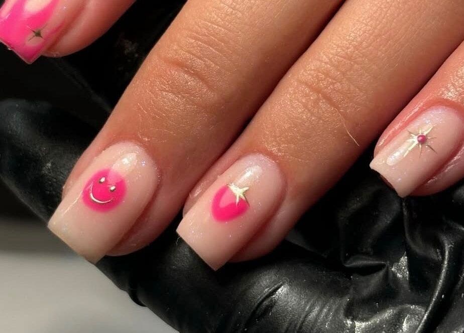 Stylish pink smiley nail art at Biabs By Abs in Llansamlet, Wales, GB. A blend of fun and elegance.