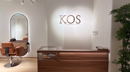 Reception and styling area at KOS Hair Salon, Hong Kong Island, HK, featuring modern decor.