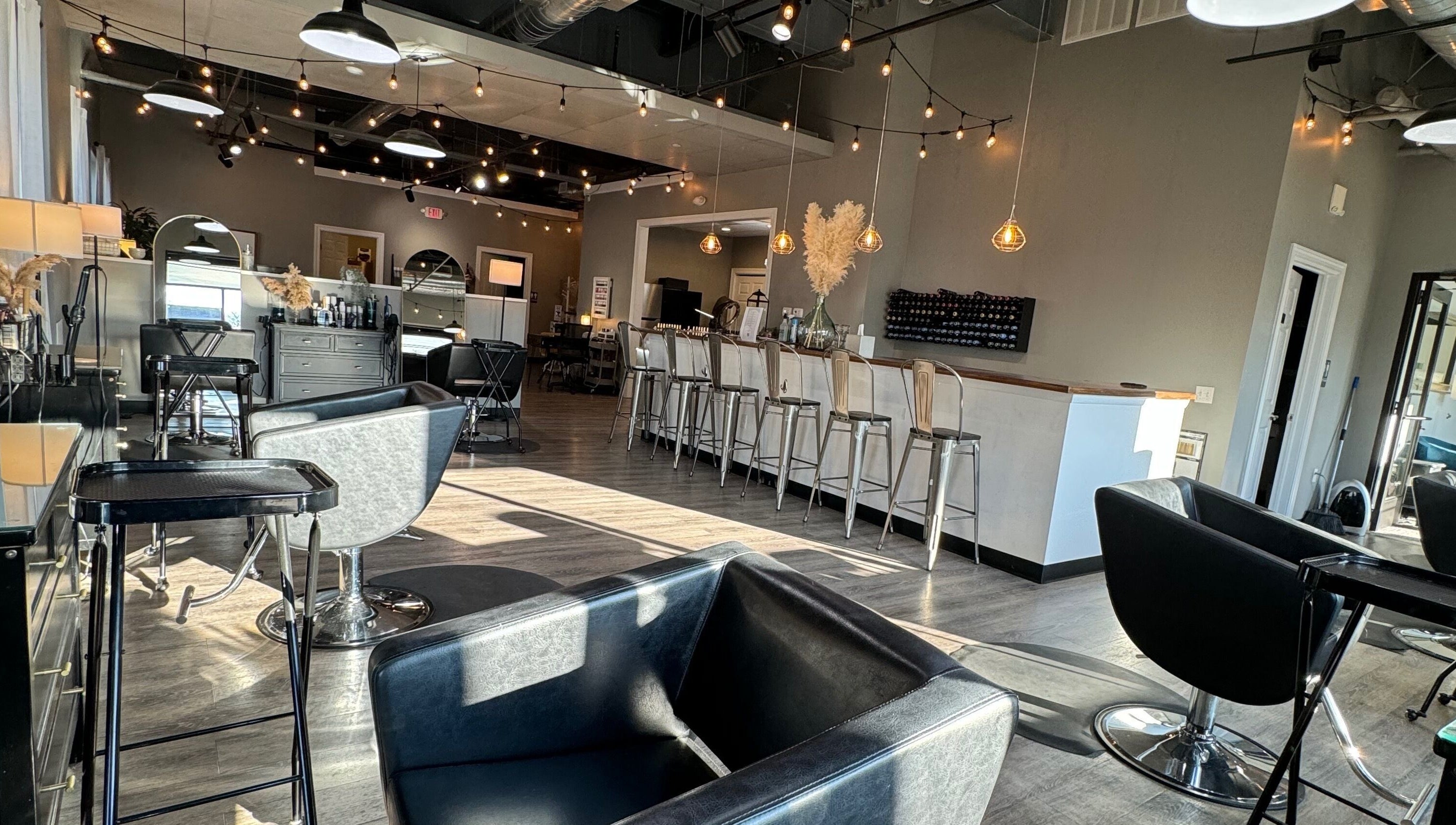 Trendy interior of Stella Salon and Spa in Taylor, Pennsylvania, US with stylish seating and modern decor.