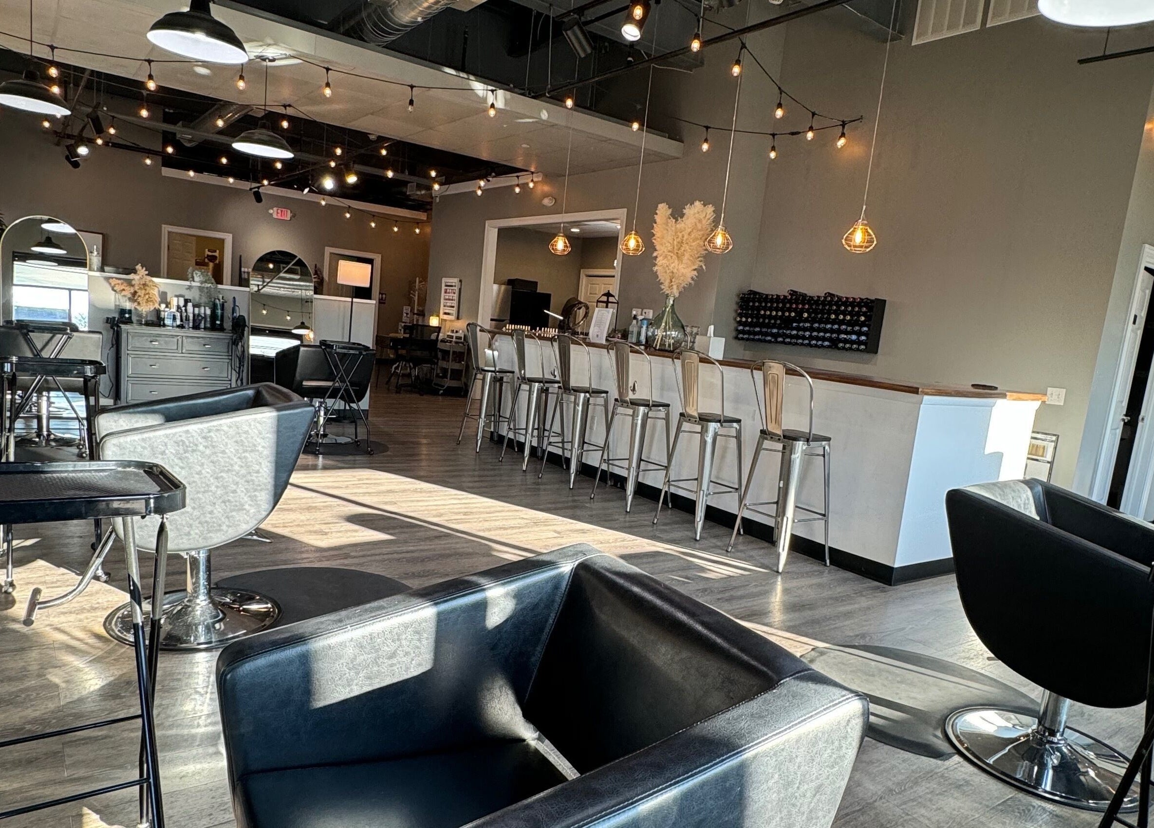 Trendy interior of Stella Salon and Spa in Taylor, Pennsylvania, US with stylish seating and modern decor.