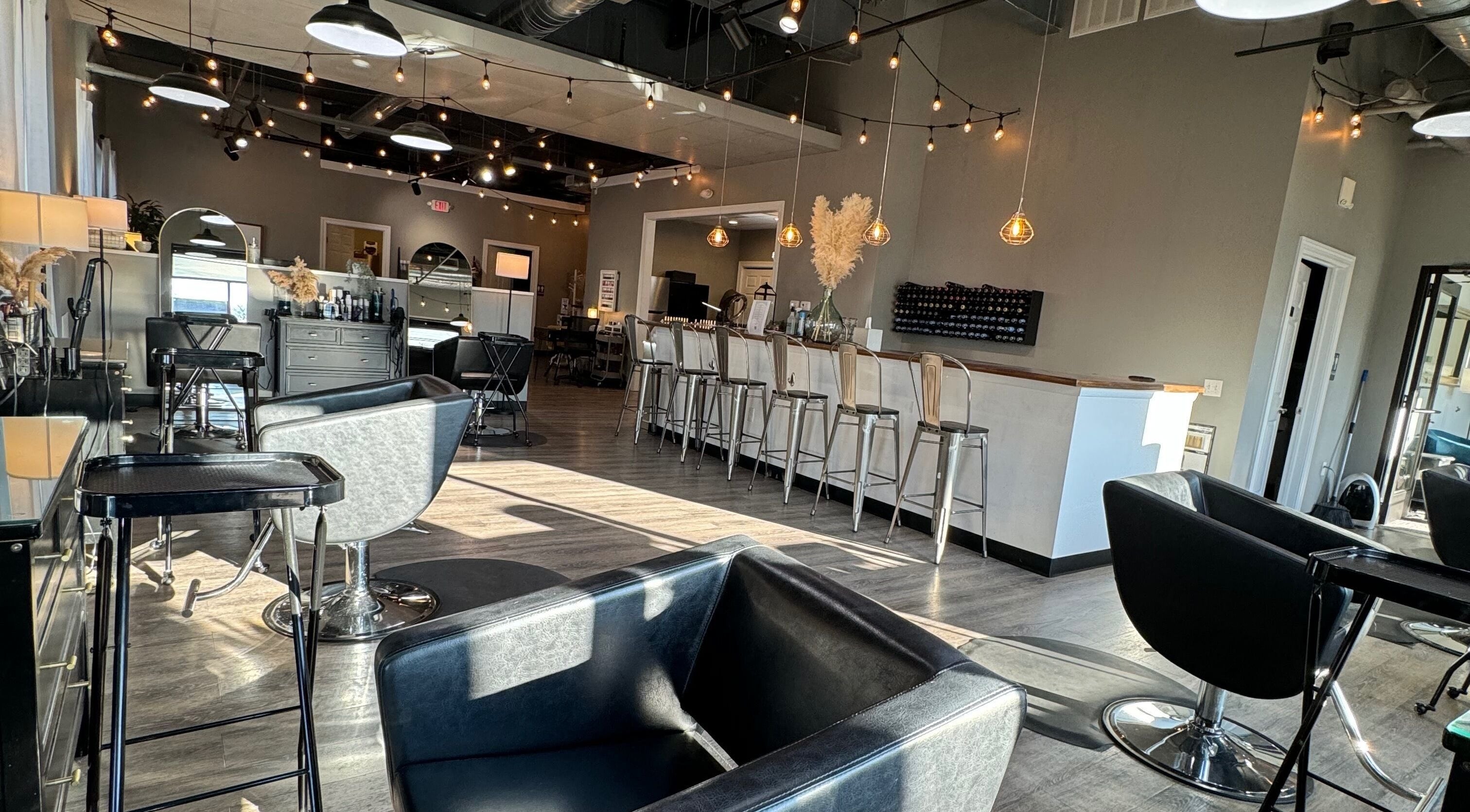 Trendy interior of Stella Salon and Spa in Taylor, Pennsylvania, US with stylish seating and modern decor.